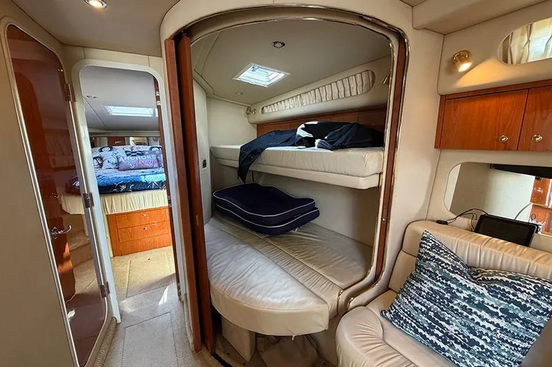 Slide: The Image of Interior of 2001 Sea Ray 410 Express Cruiser with cozy cabin and bunk beds. - 19