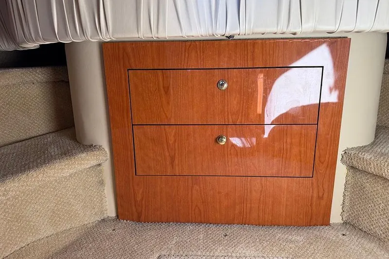 Slide: The Image of Wooden cabinet with two drawers inside a 2001 Sea Ray 410 Express Cruiser. - 22