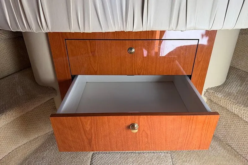 Slide: The Image of Open wooden drawer in 2001 Sea Ray 410 Express Cruiser interior. - 23