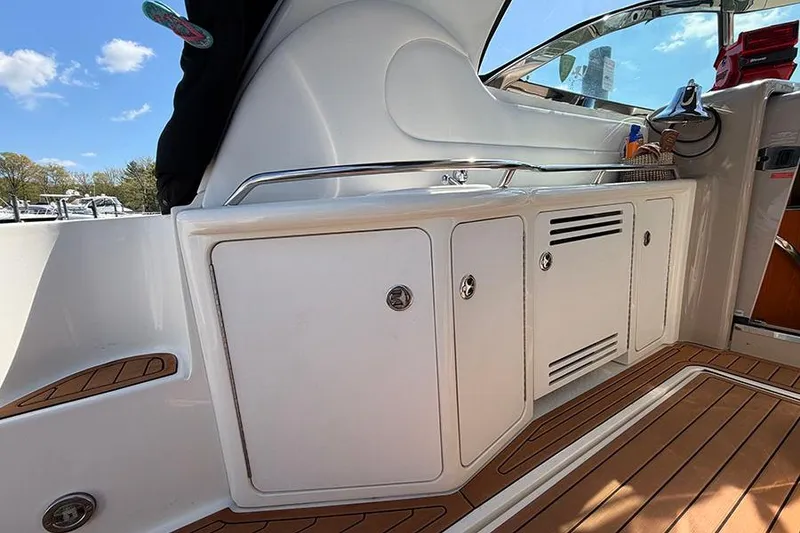 Slide: The Image of 2001 Sea Ray 410 Express Cruiser interior with sleek cabinetry and wood flooring. - 7