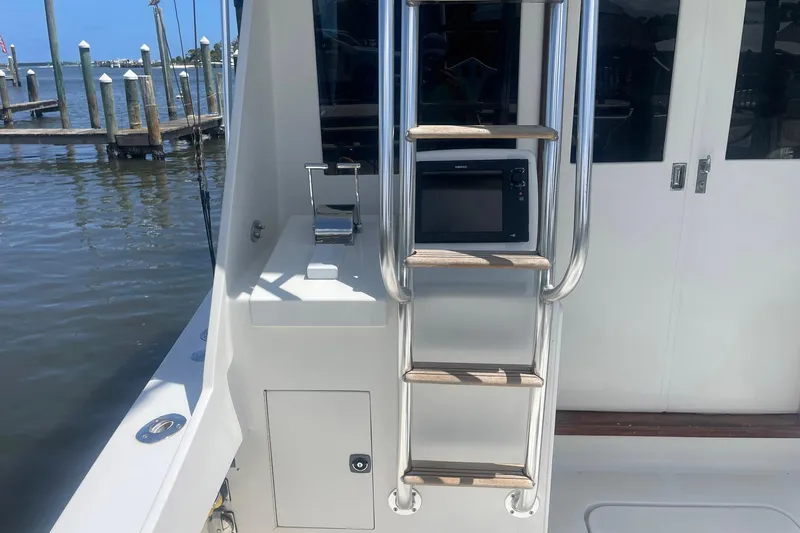 Slide: The Image of 1968 Hatteras 34 Sport Fisherman boat interior with ladder and control panel. - 10