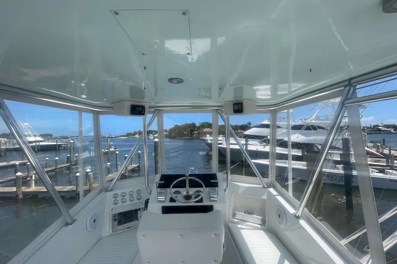 Slide: The Image of Interior view of a 1968 Hatteras 34 Sport Fisherman boat at a marina. - 13