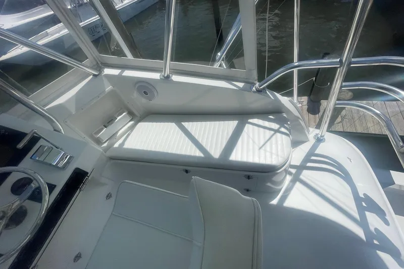 Slide: The Image of Interior view of a 1968 Hatteras 34 Sport Fisherman boat with white seating. - 14