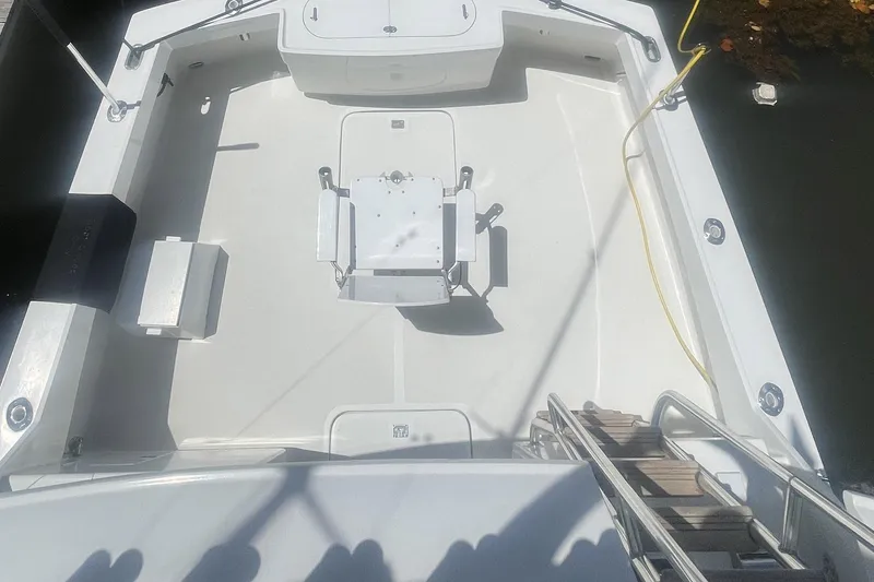 Slide: The Image of 1968 Hatteras 34 Sport Fisherman boat deck with fishing chair and equipment. - 16