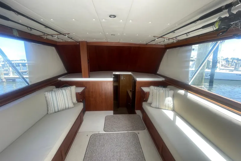 Slide: The Image of Interior of a 1968 Hatteras 34 Sport Fisherman boat with seating and fishing rods. - 17