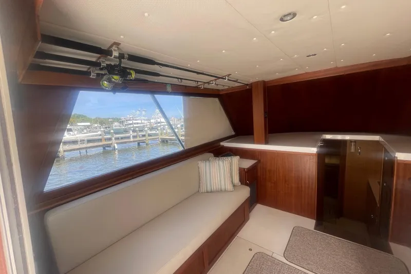 Slide: The Image of Interior of 1968 Hatteras 34 Sport Fisherman with seating and fishing rods. - 18