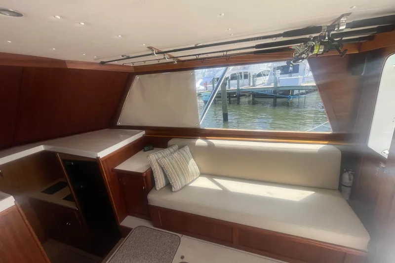 Slide: The Image of Interior of 1968 Hatteras 34 Sport Fisherman with seating and fishing rods. - 19