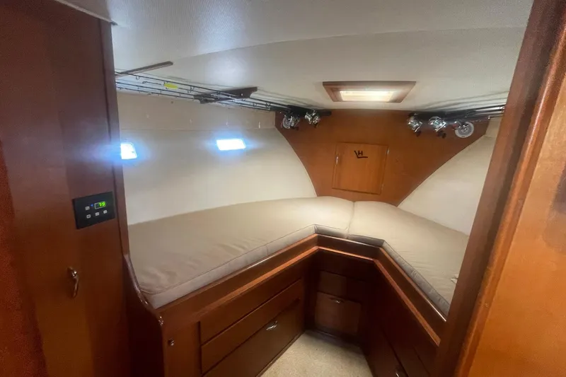 Slide: The Image of Interior cabin of a 1968 Hatteras 34 Sport Fisherman boat with cozy bedding. - 26