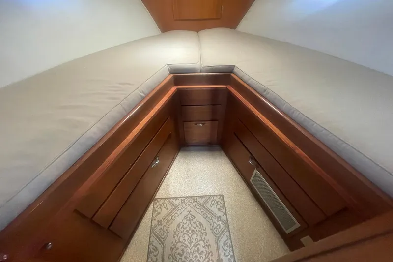 Slide: The Image of Interior cabin of 1968 Hatteras 34 Sport Fisherman with wooden storage and cushioned seating. - 27