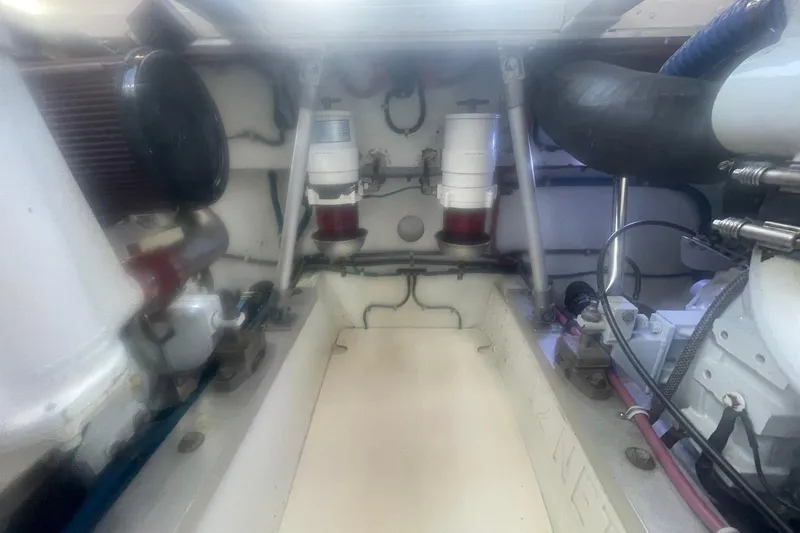 Slide: The Image of Engine room of a 1968 Hatteras 34 Sport Fisherman boat, showcasing mechanical components. - 29