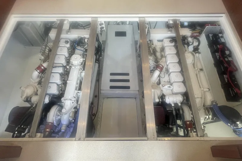 Slide: The Image of Engine room of a 1968 Hatteras 34 Sport Fisherman, showcasing dual engines and components. - 30