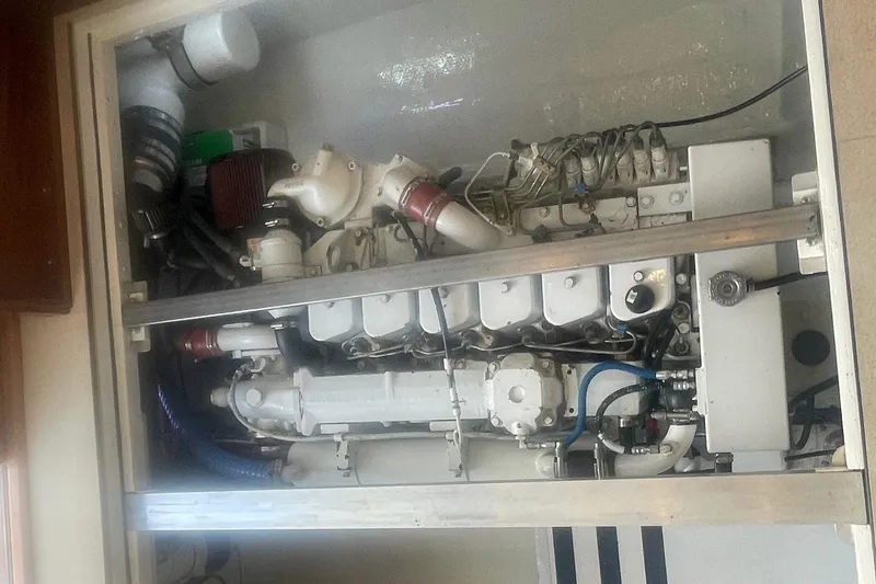Slide: The Image of Engine compartment of a 1968 Hatteras 34 Sport Fisherman boat, showcasing mechanical components. - 31