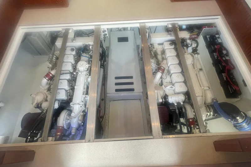 Slide: The Image of Engine room of a 1968 Hatteras 34 Sport Fisherman, showcasing dual engines and components. - 32