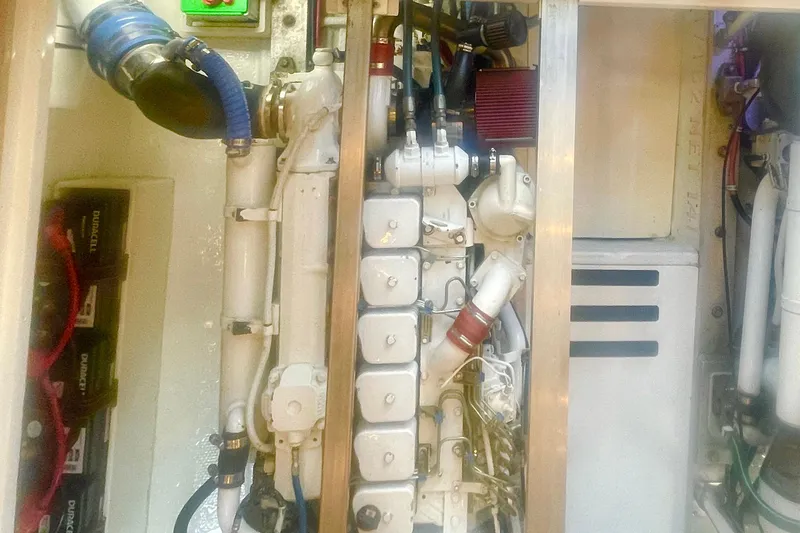 Slide: The Image of Engine room of a 1968 Hatteras 34 Sport Fisherman, showcasing mechanical components. - 33
