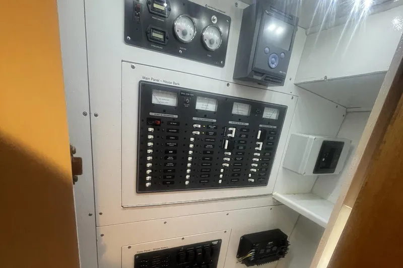 Slide: The Image of Electrical control panel inside a 1968 Hatteras 34 Sport Fisherman boat. - 34