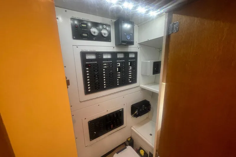 Slide: The Image of Electrical panel inside a 1968 Hatteras 34 Sport Fisherman boat, featuring gauges and switches. - 35
