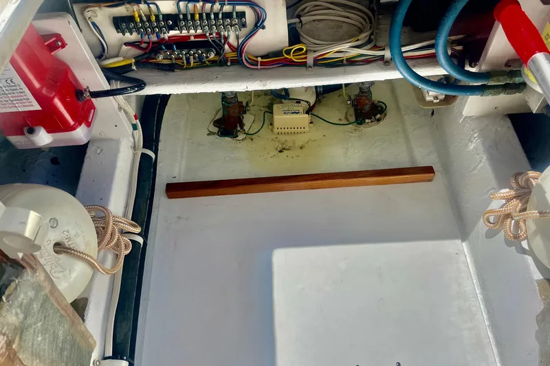 Slide: The Image of 1968 Hatteras 34 Sport Fisherman engine compartment with wiring and components. - 37