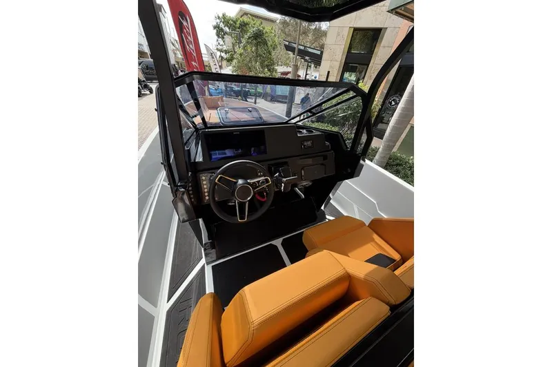 Slide: The Image of Futuristic Iron 907 boat interior with sleek design and modern controls, 2025 model. - 11