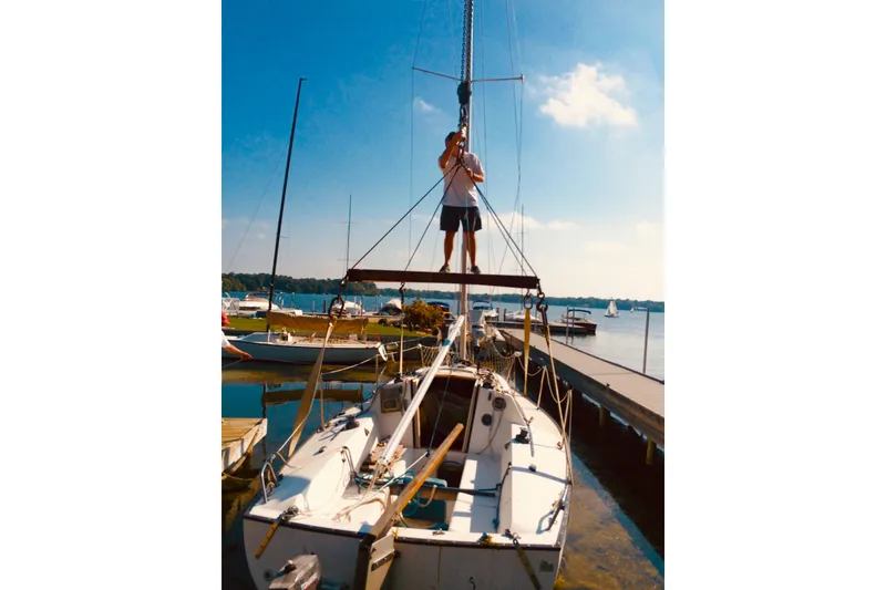 Slide: The Image of Man standing on 1984 S2 7.9 Grand Slam sailboat at dockside. - 3
