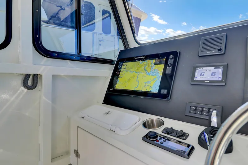 Slide: The Image of Cockpit of 2024 Nerowalker 35 boat with navigation display and controls. - 12