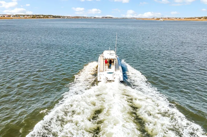 Slide: The Image of Aerial view of 2024 Nerowalker 35 boat cruising on open water. - 21