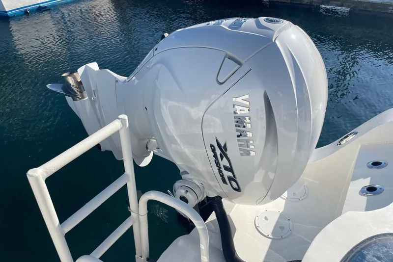 Slide: The Image of Yamaha XTO Offshore engine on 2024 Nerowalker 35 boat, docked in calm water. - 7