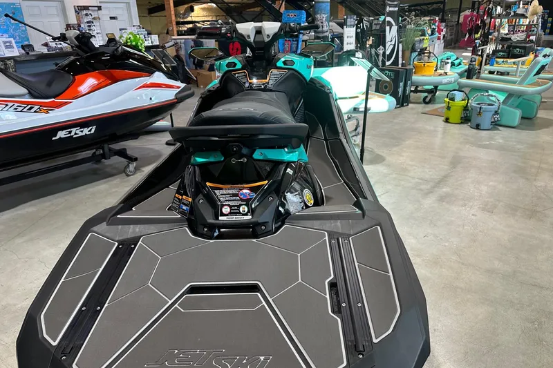 Slide: The Image of 2026 Kawasaki Jetski Ultra 310LX-S displayed in a showroom with other watercraft. - 2