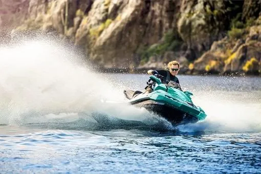 Slide: The Image of 2026 Kawasaki Jetski Ultra 310LX-S speeding on water near rocky cliffs. - 4