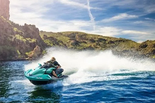 Slide: The Image of 2026 Kawasaki Jetski Ultra 310LX-S speeding on a scenic lake. - 5