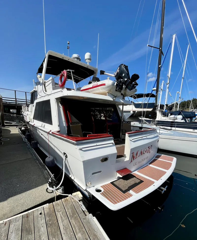 Slide: The Image of 1989 Angel Pilothouse yacht docked at marina on a sunny day. - 1