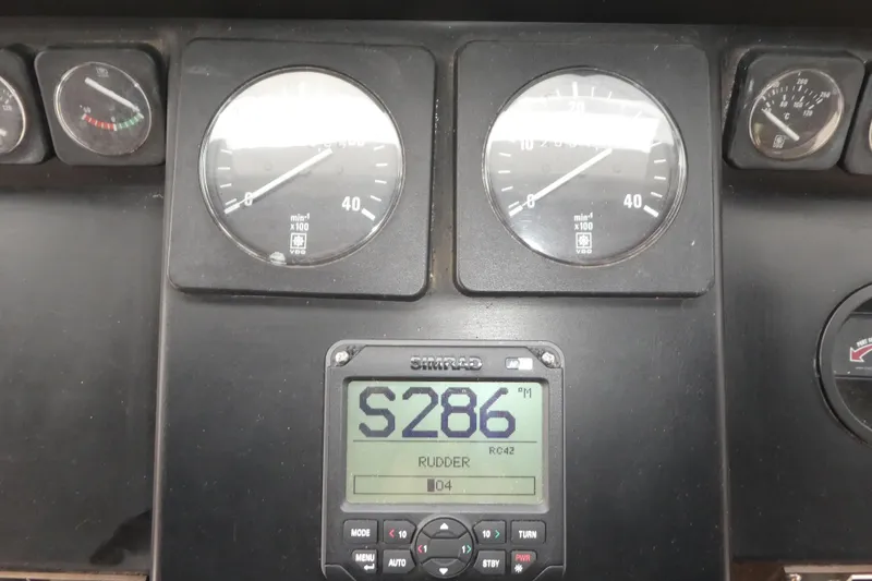Slide: The Image of Instrument panel of a 1989 Angel Pilothouse boat with gauges and digital display. - 16