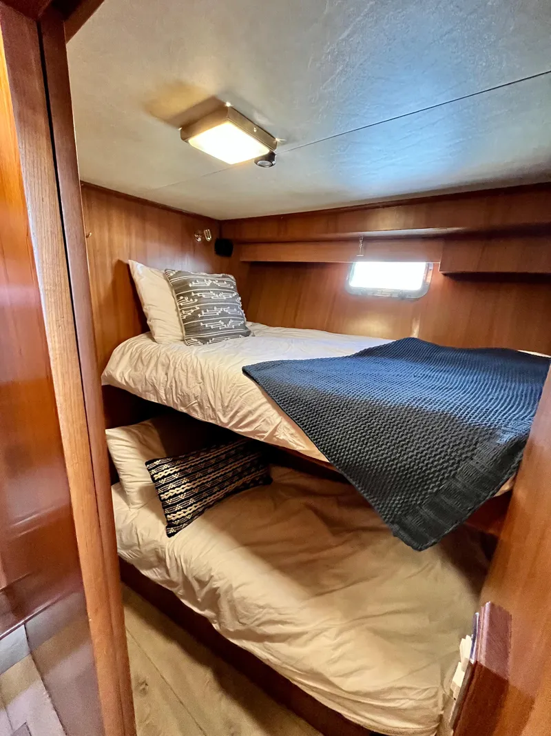 Slide: The Image of Cozy bunk beds in 1989 Angel Pilothouse boat cabin. - 26
