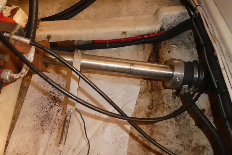 Slide: The Image of Engine compartment of a 1989 Angel Pilothouse boat, showing mechanical components and wiring. - 37
