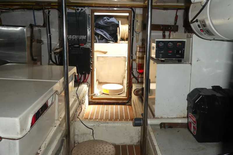 Slide: The Image of 1989 Angel Pilothouse interior with control panels and equipment. - 38