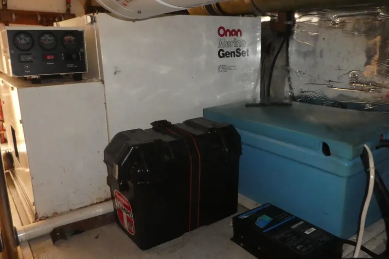 Slide: The Image of Engine room of 1989 Angel Pilothouse with Onan Marine GenSet and battery box. - 41