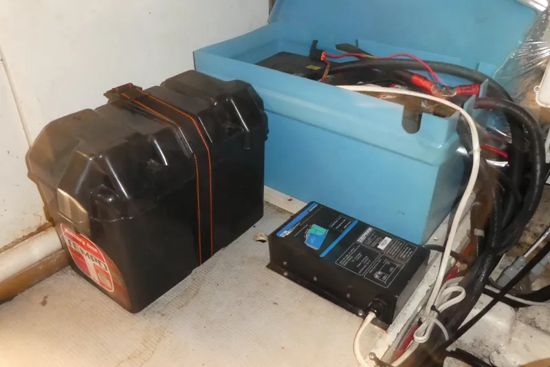 Slide: The Image of Battery setup in 1989 Angel Pilothouse boat with wiring and charger. - 42