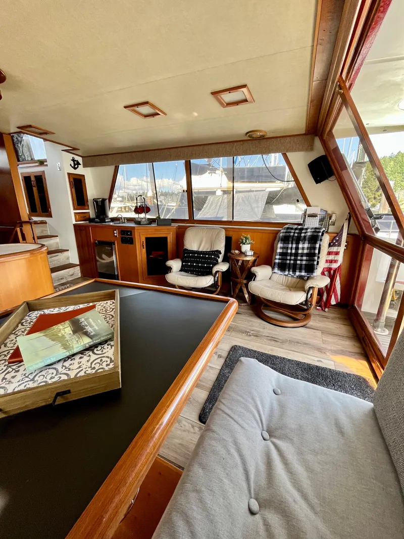 Slide: The Image of 1989 Angel Pilothouse interior with cozy seating and large windows. - 5