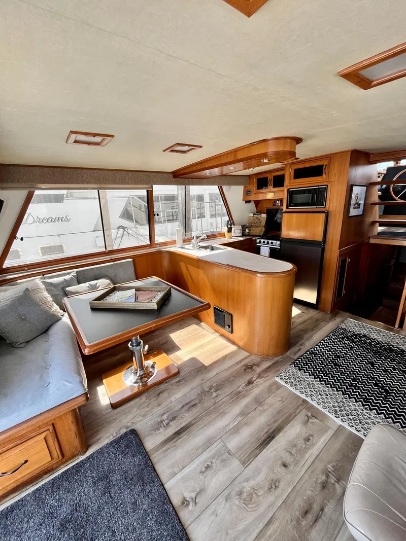 Slide: The Image of 1989 Angel Pilothouse interior with modern kitchen and cozy seating area. - 7