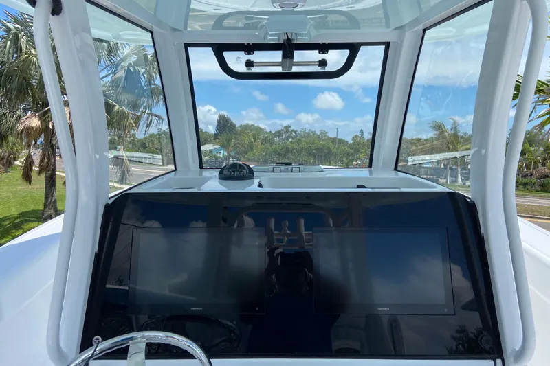 Slide: The Image of 2026 Sportsman Heritage 321 Center Console dashboard with dual screens and scenic view. - 16