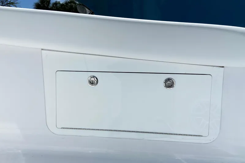 Slide: The Image of 2026 Sportsman Heritage 321 Center Console storage compartment detail. - 31