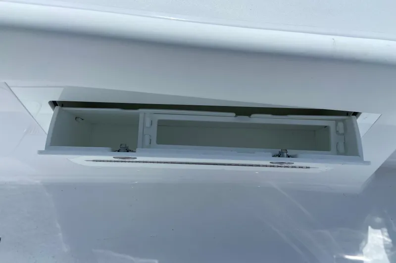 Slide: The Image of Open storage compartment on Sportsman Heritage 321 Center Console 2026. - 32