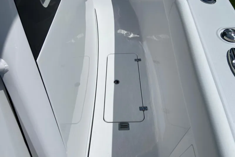 Slide: The Image of 2026 Sportsman Heritage 321 Center Console deck with storage hatch and sleek design. - 33