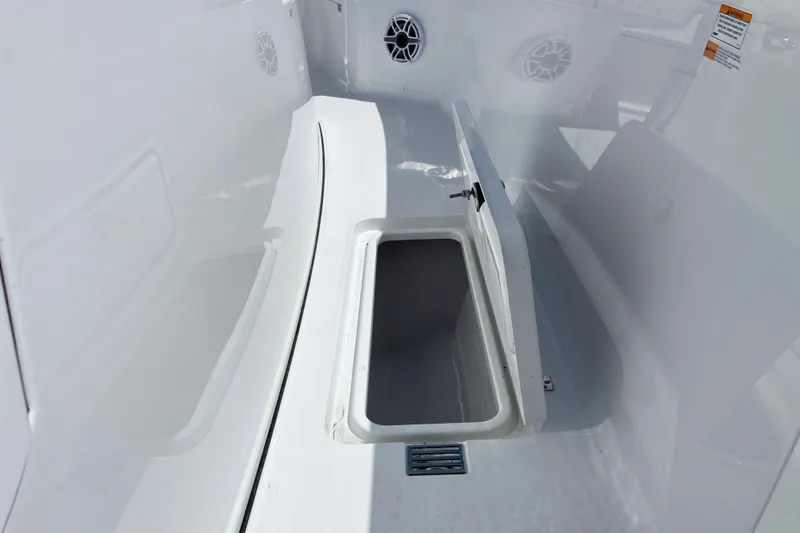 Slide: The Image of 2026 Sportsman Heritage 321 Center Console boat storage compartment detail. - 34