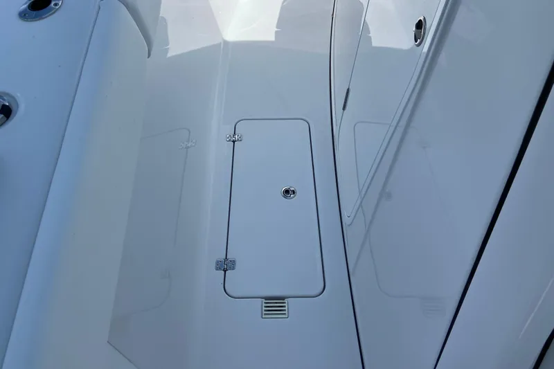 Slide: The Image of 2026 Sportsman Heritage 321 Center Console deck with storage compartment. - 35