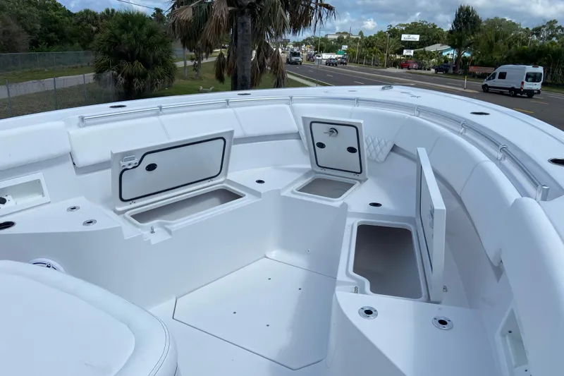 Slide: The Image of 2026 Sportsman Heritage 321 Center Console boat with open storage compartments and seating. - 38