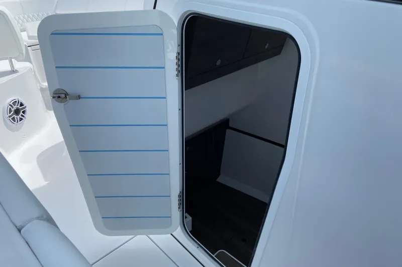 Slide: The Image of Open cabin door on 2026 Sportsman Heritage 321 Center Console boat interior. - 49