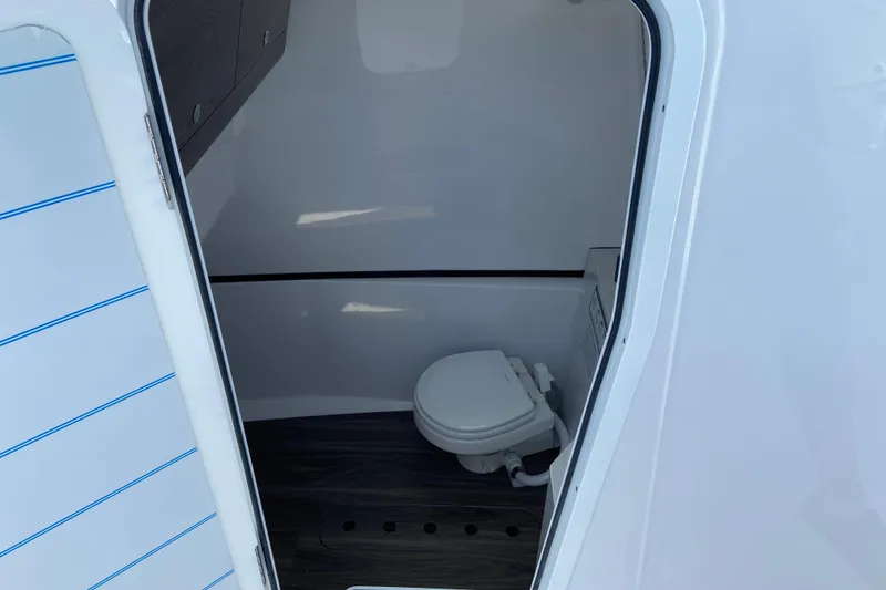 Slide: The Image of Interior view of 2026 Sportsman Heritage 321 Center Console boat's compact bathroom. - 50