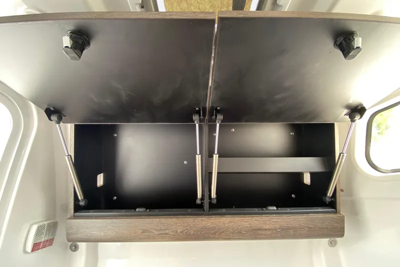 Slide: The Image of Open storage compartment in 2026 Sportsman Heritage 321 Center Console boat. - 52