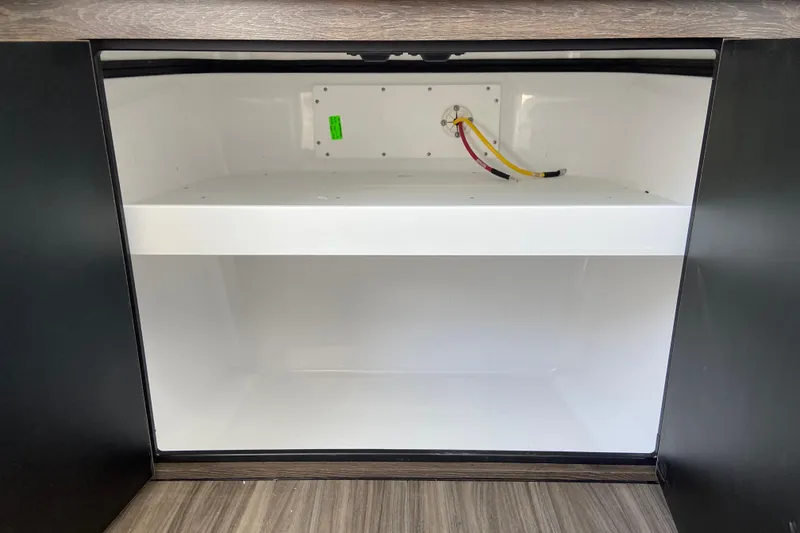 Slide: The Image of Open storage compartment in 2026 Sportsman Heritage 321 Center Console boat. - 55