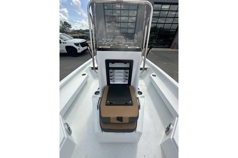 Slide: The Image of 2025 Xpress H20B Bay boat interior with console and seating, showcasing modern design. - 10